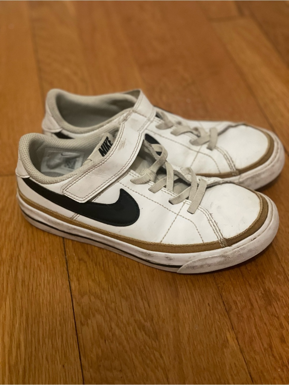 Nike Kids White Sneakers with Black Swoosh and Tan Trim